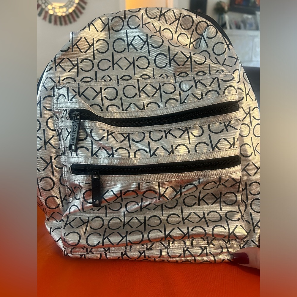 - Calvin Klein Backpack  new w tags, super light & comfortable, great for travel